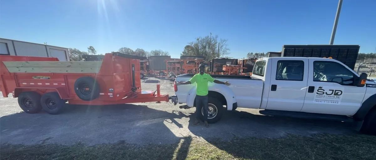 SJD Consultants crew with branded truck on job site